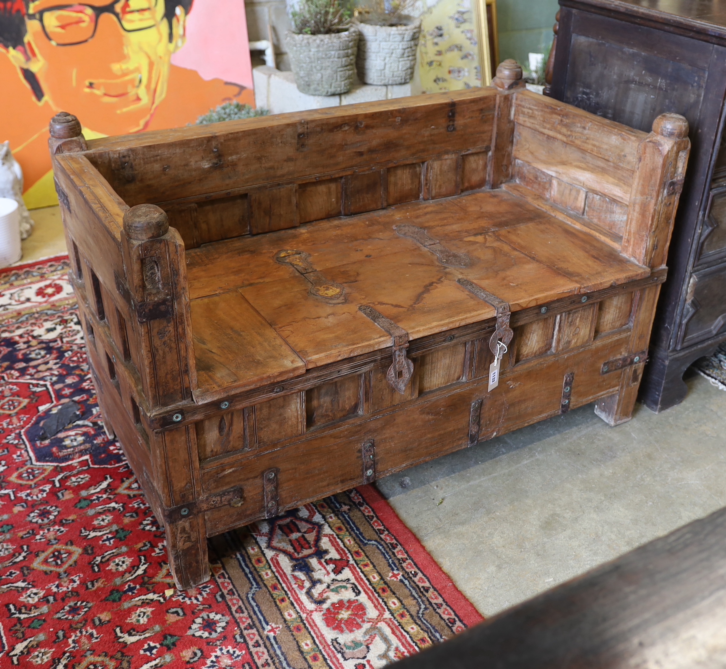 An Indian iron mounted hardwood box seat settle, width 124cm, depth 65cm, height 81cm